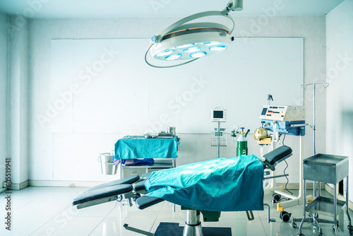 Empty interior old operating room and equipment in hospital.Medical device for surgeon surgical emergency patient in blue tone style.Save life medical treatment concept.