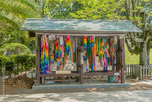 Origami steamers hanging in wooden shelter at Peace Memorial Park.