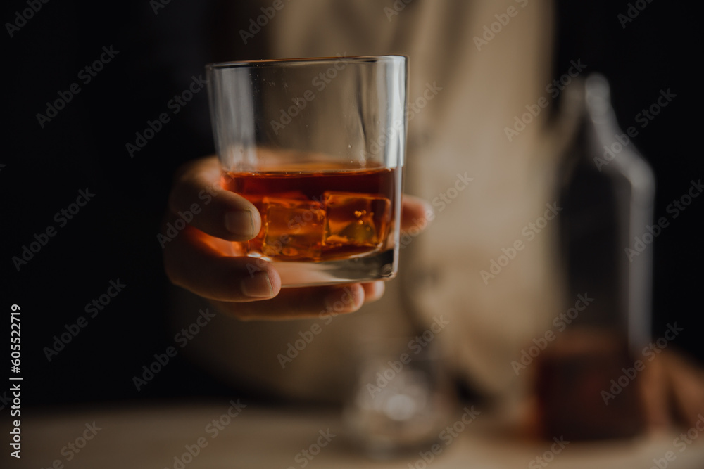 Bartender serving whiskey on wooden bar ,Close-up shot of whiskey glass Bartender serving whiskey on wooden bar ,Close-up shot of whiskey glass