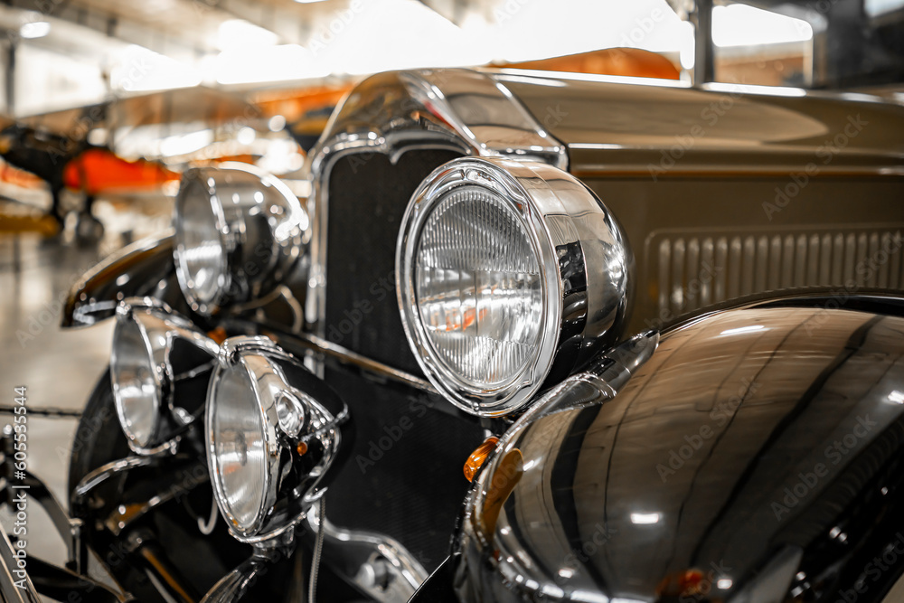 Four round headlights on the front of a retro old vintage car