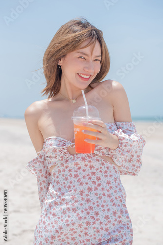 young slim beautiful woman on sunset beach, playful, summer vacation, sunny, having fun, positive mood, romantic, traveller, happy, Happy mixed race girl in casual outfit with wind in her hair.