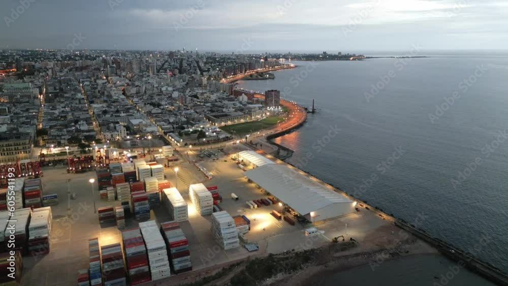 Close Fly of Illuminated Shipping Containers in the Port of Montevideo at Sunset Close Fly of Illuminated Shipping Containers in the Port of Montevideo at Sunset