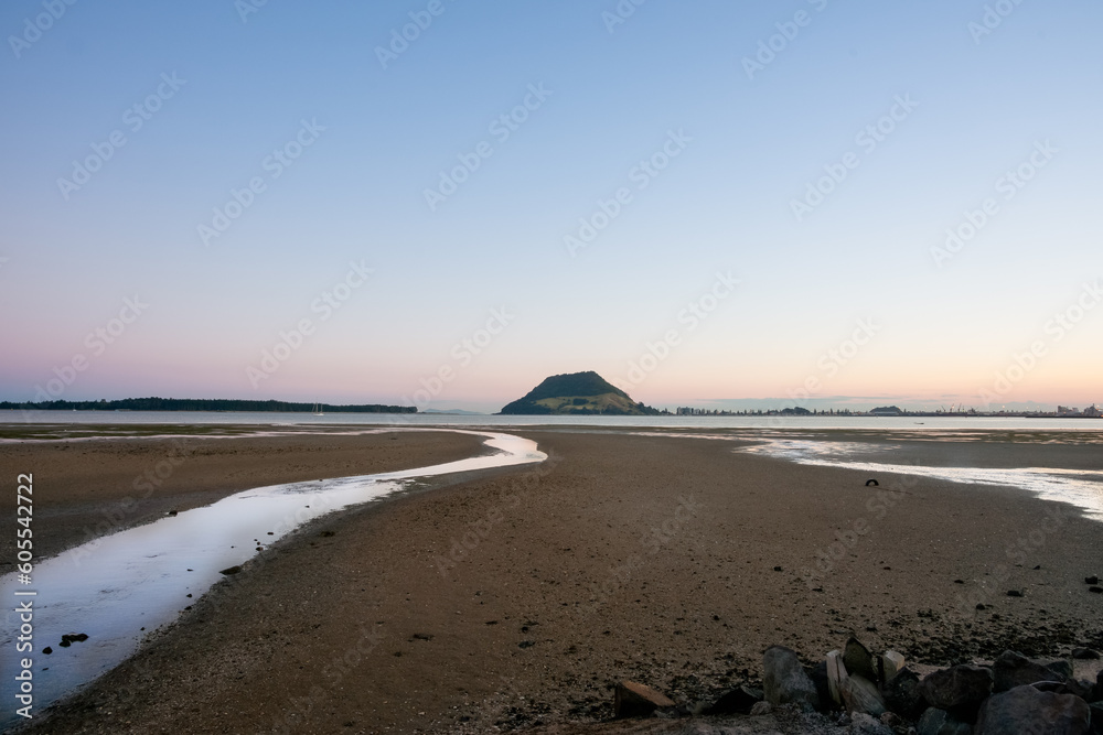 Landmarks Mount Maunganui on distant horizon at sunrise