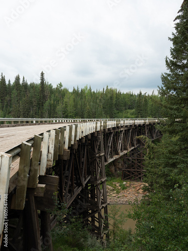 Vertical image of Old wooden plank bridge in British Columbia which was one of the bridges on the old section of the Alaska Highway