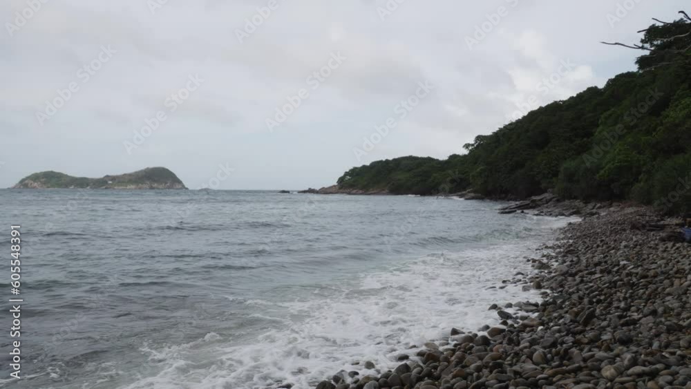 Rough Waves Splashing On The Stones of Con Dao Island, Vietnam. - slow motion panoramic shot Rough Waves Splashing On The Stones of Con Dao Island, Vietnam. - slow motion panoramic shot