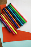 Colorful Crayons and flomasters on paper background stock photo