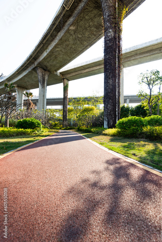 Red sidewalk under the overpass