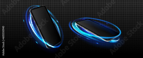 Realistic set of 3D smartphones with neon light effect isolated on transparent background. Vector illustration of mobile phone mockup with blank touchscreen in blue circle frame. Modern technology
