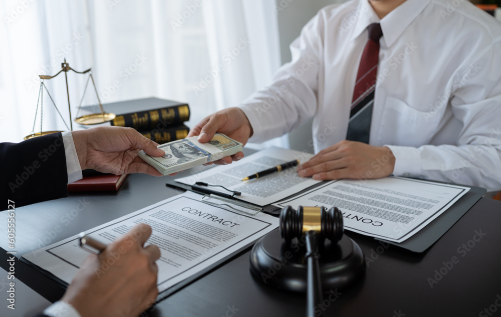 Businessman handing bribe money to lawyer or official before signing contract Agreement to help win court cases The concept of bribery and kickbacks. Fraud and Corruption Businessman handing bribe money to lawyer or official before signing contract Agreement to help win court cases The concept of bribery and kickbacks. Fraud and Corruption