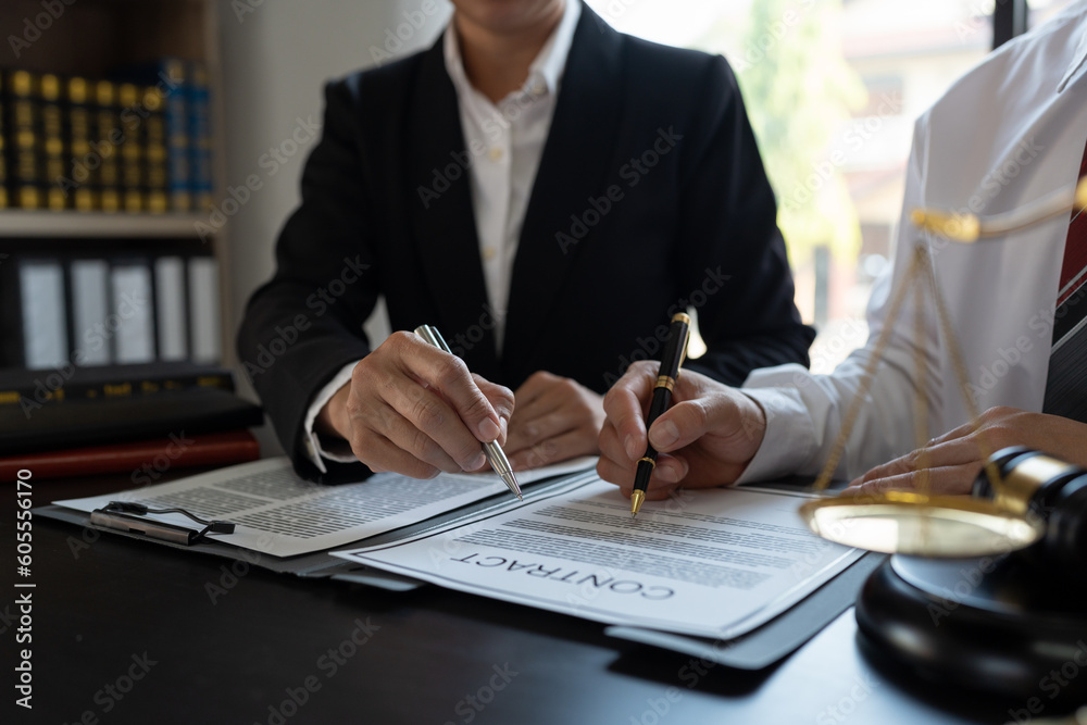 Businessmen and lawyers discuss and explain the contract documents Legal treaty before the signing of a business contract. Businessmen and lawyers discuss and explain the contract documents Legal treaty before the signing of a business contract.
