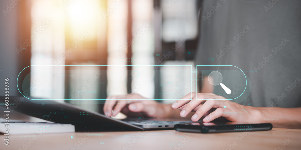 Obraz premium Businessman searching for business information through virtual screen,Searching for information he is interested in through online websites,keyword search ideas to find references,insight research