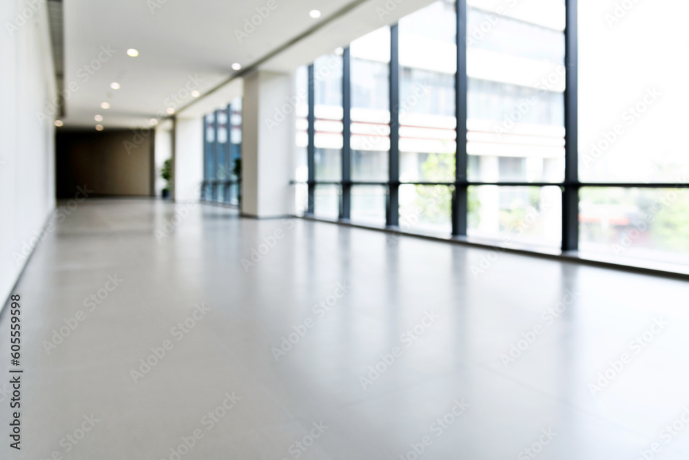 Abstract defocused blurred background of empty long corridor in the modern hospital