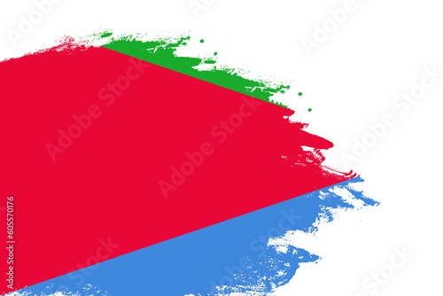 Eritrea flag on a stained stroke brush painted isolated white background with copy space