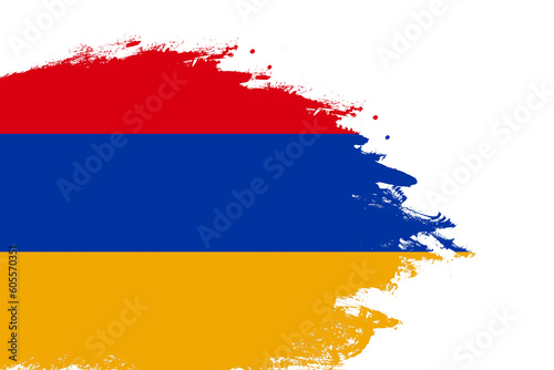 Armenia flag on a stained stroke brush painted isolated white background with copy space