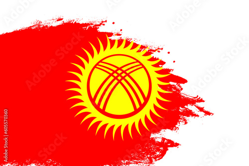 Kyrgyzstan flag on a stained stroke brush painted isolated white background with copy space © Xookits