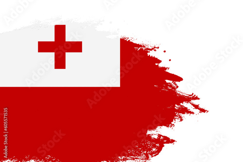 Tonga flag on a stained stroke brush painted isolated white background with copy space