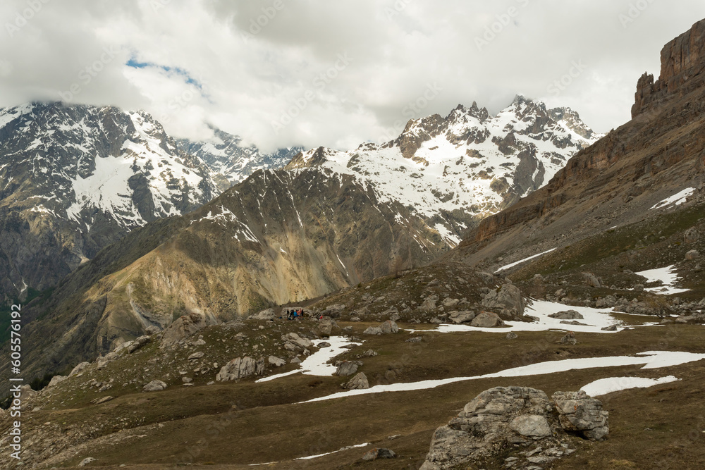 Hiking in the Ecrins massif under the Cime de la Condamine in the French Alps