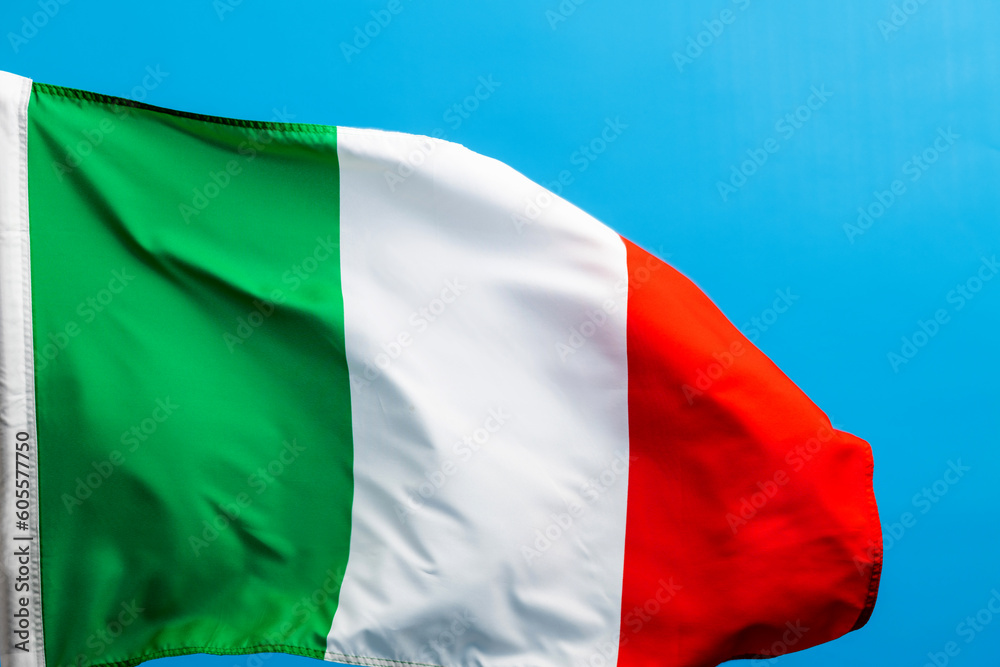 Obraz premium Italian flag waving on blue background