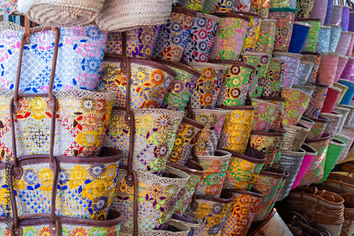 Market stall in the Spanish coastal town Marbella selling handmade beach bags or baskets.