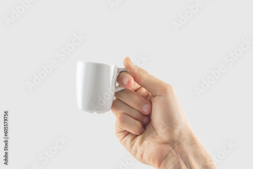 Holding a cup of espresso 