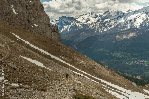 Hiking in the Ecrins massif under the Cime de la Condamine in the French Alps