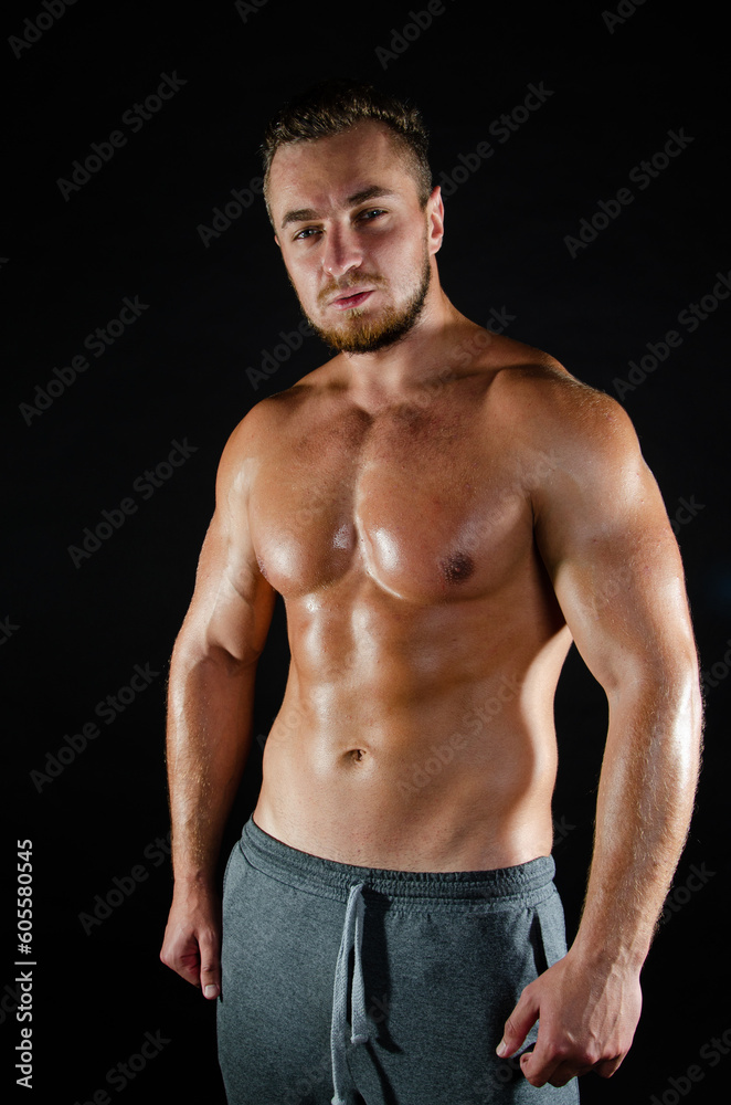 Young handsome guy on a diet. A man with a beautiful athletic body.	