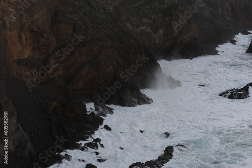 Waves breaking on the rocks of rugged Atlantic Ocean coast in Madeira Island, Portugal, Europe