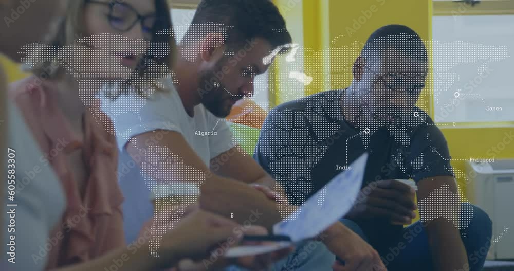 Animation of data processing over world map against diverse colleagues discussing at office