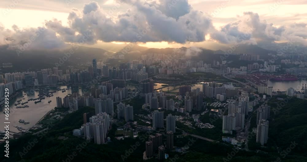 Aerial Panorama of Tsing Yi residential area in foreground, Kowloon, Tsuen Wan District and mountain range in background at Sunrise Aerial Panorama of Tsing Yi residential area in foreground, Kowloon, Tsuen Wan District and mountain range in background at Sunrise