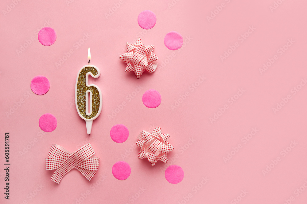 Number 6 on pastel pink background with festive decor. Happy birthday candles. The concept of celebrating a birthday, anniversary, important date, holiday. Copy space. Banner