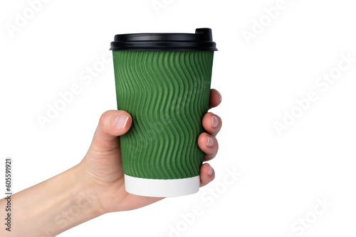 Woman's hand holds green paper cup with coffee or tea isolated on white background. Coffee to go. Close-up. Selective focus.