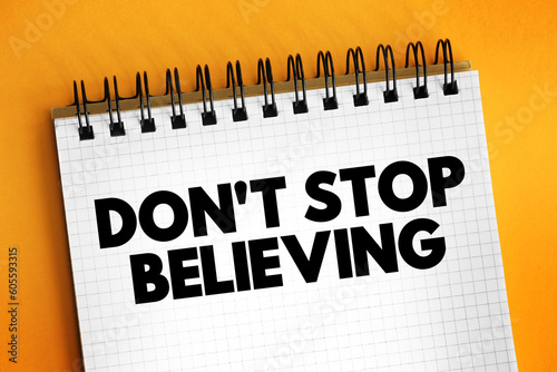 Don't Stop Believing text on notepad, concept background