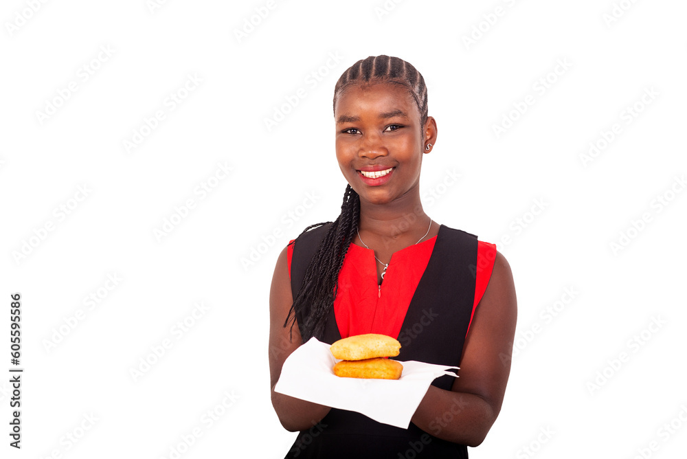 close up of a beautiful young girl presenting cakes, smiling. close up of a beautiful young girl presenting cakes, smiling.
