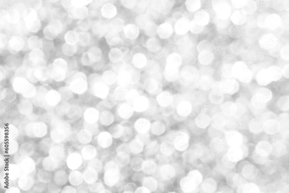 White and gray bokeh glitter sparking light background.  New Year, Christmas and all celebration background concepts.
