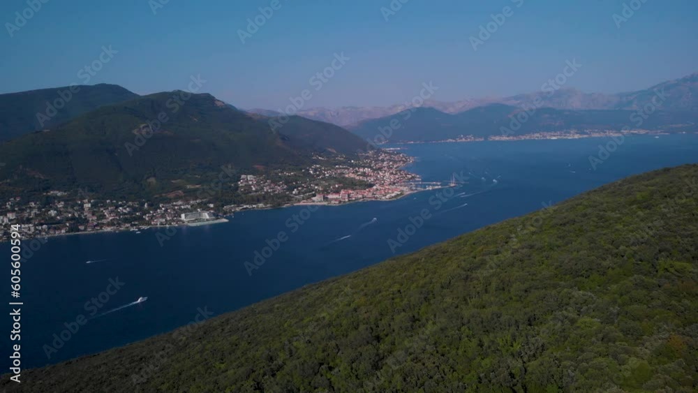 Distant View Of Herceg Novi Coastal Town With Denovici Village In Bay Of Kotor In Montenegro. Aerial Wide Shot Distant View Of Herceg Novi Coastal Town With Denovici Village In Bay Of Kotor In Montenegro. Aerial Wide Shot