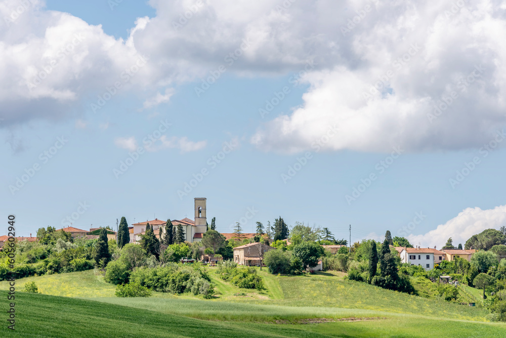 The village of Orciano Pisano, Italy, completely surrounded by the greenery of the Tuscan countryside in spring