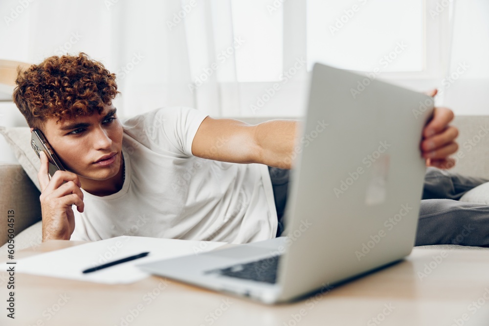 man interior teenager text text message couch freelancer cyberspace phone technology man interior teenager text text message couch freelancer cyberspace phone technology
