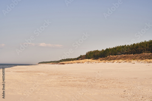 Empty sea shore in the morning. Baltic Sea sand beach. Concept of vacationing.