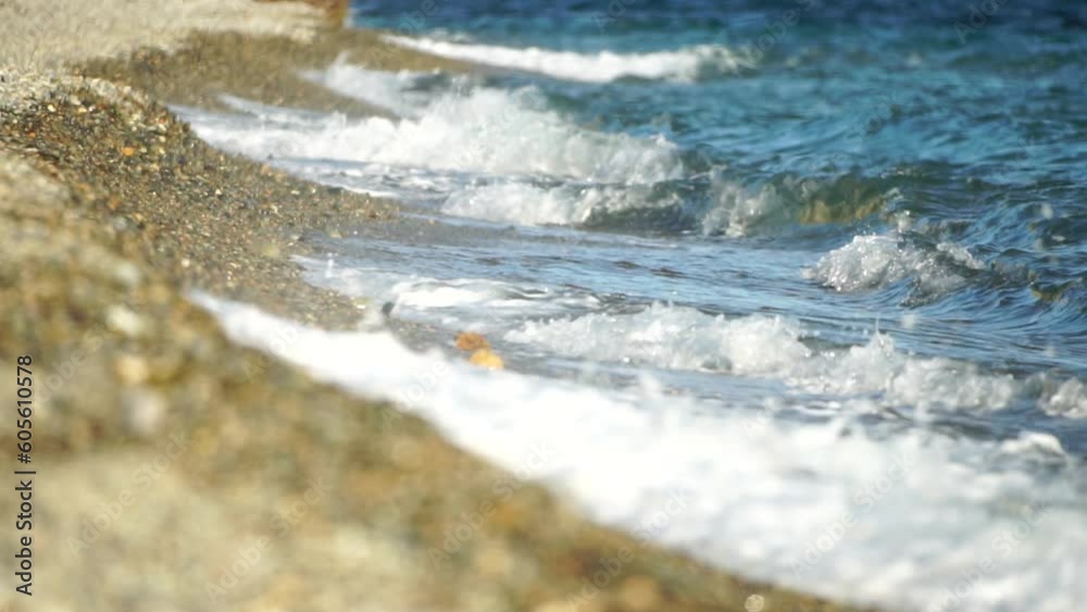 Small sea wave, Blurred Soft foamy waves washing golden pebbled beach on sunset. Ocean Waves On Beach. Nobody. Holiday recreation concept. Abstract nautical summer ocean sunset nature background. Small sea wave, Blurred Soft foamy waves washing golden pebbled beach on sunset. Ocean Waves On Beach. Nobody. Holiday recreation concept. Abstract nautical summer ocean sunset nature background.