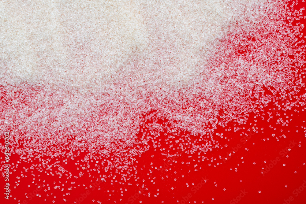 White sugar crystals on blue background White sugar crystals on blue background