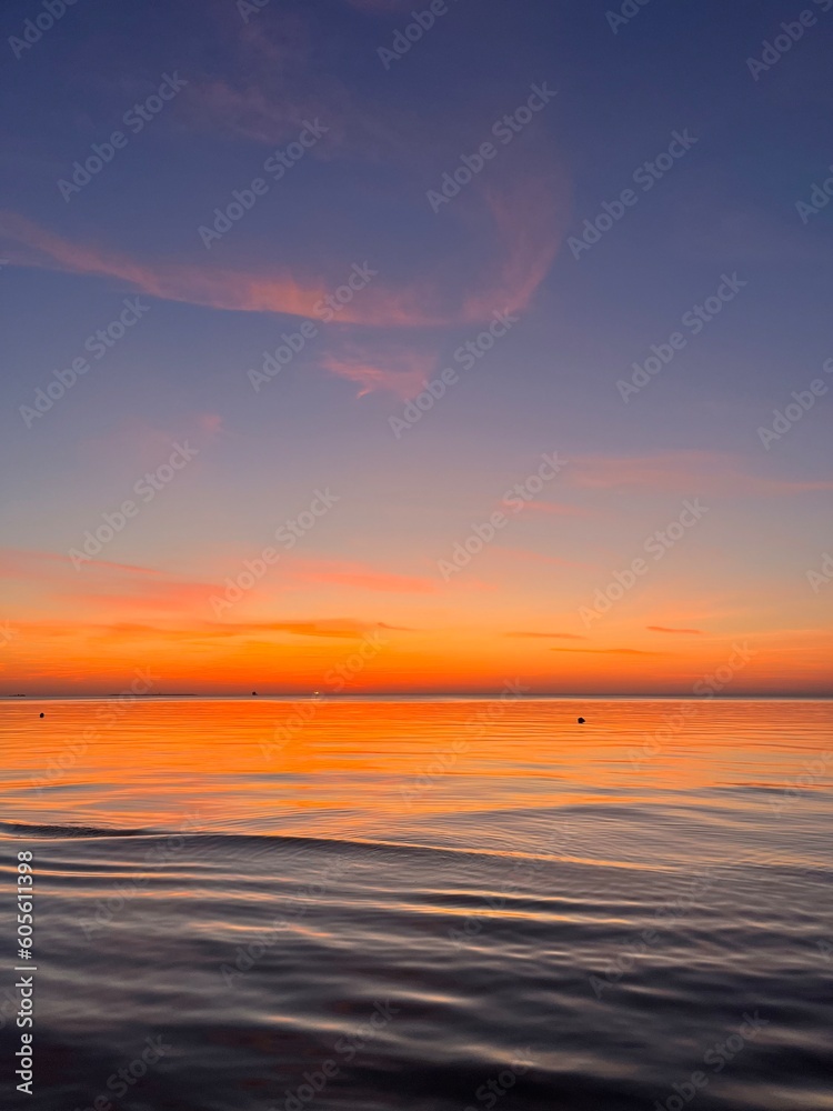 Seascape after the sunset, orange sunset sea horizon, twilights sea view background