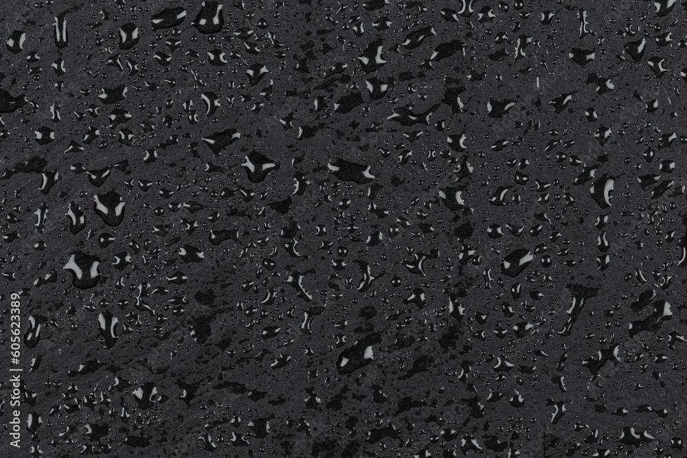 Water drops on dark stone Water drops on dark stone