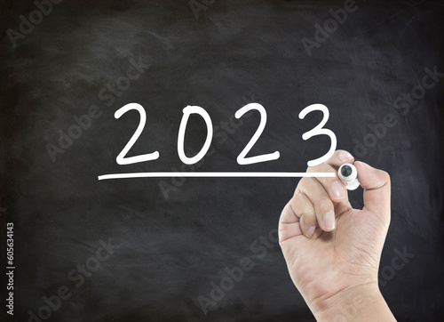 Year 2023 wording with handwriting on black board