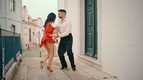 Sensual dancers performing latin american style on city street. Couple dancing 