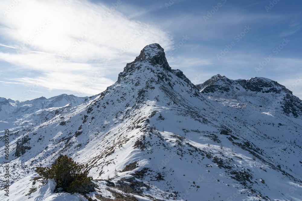 Beautiful Torretta peak, with its snow-capped summit set against a bright blue sky