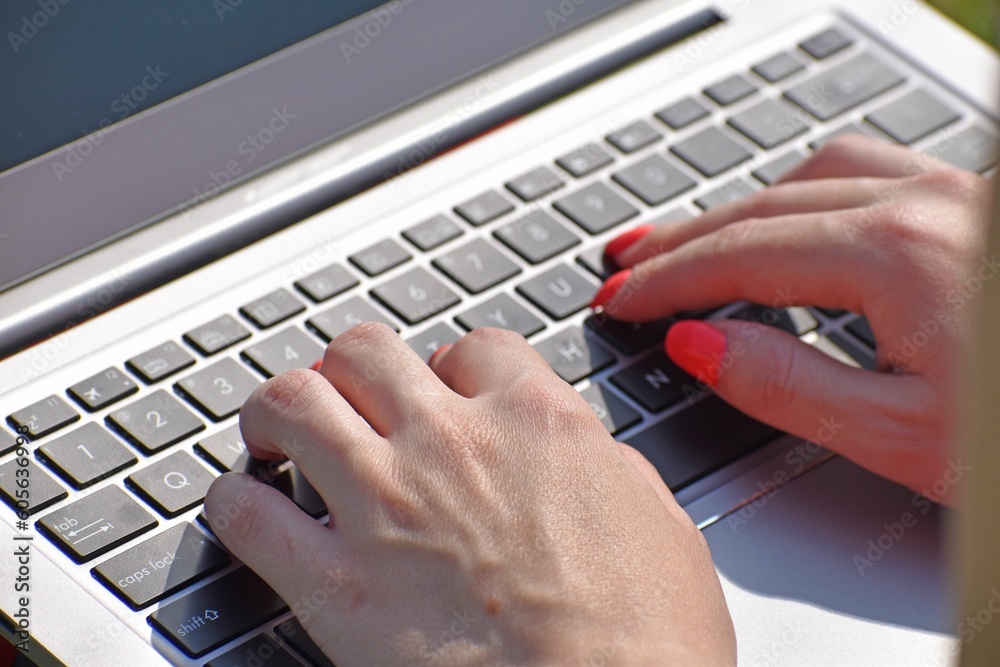 Closeup of a woman's hands using laptop Closeup of a woman's hands using laptop