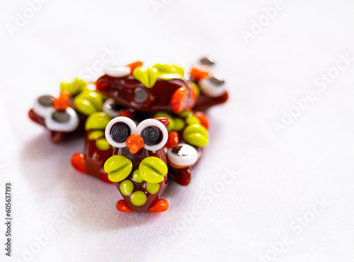 Bright glass beads in the form of an owl