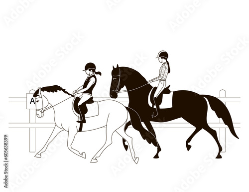 Two young horsewomen in training at the equestrian club