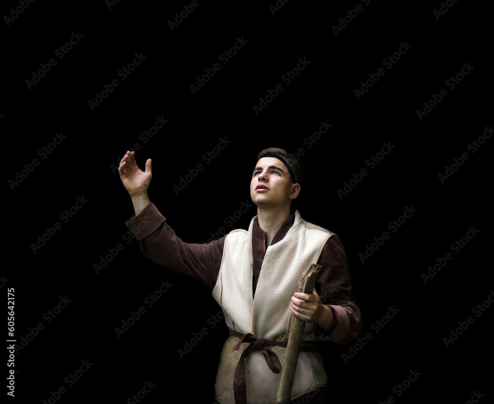 Praying man with raised hand
