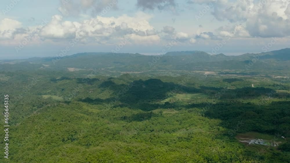 Mountains and hills with green vegetation and trees in the tropics. Negros, Philippines Mountains and hills with green vegetation and trees in the tropics. Negros, Philippines
